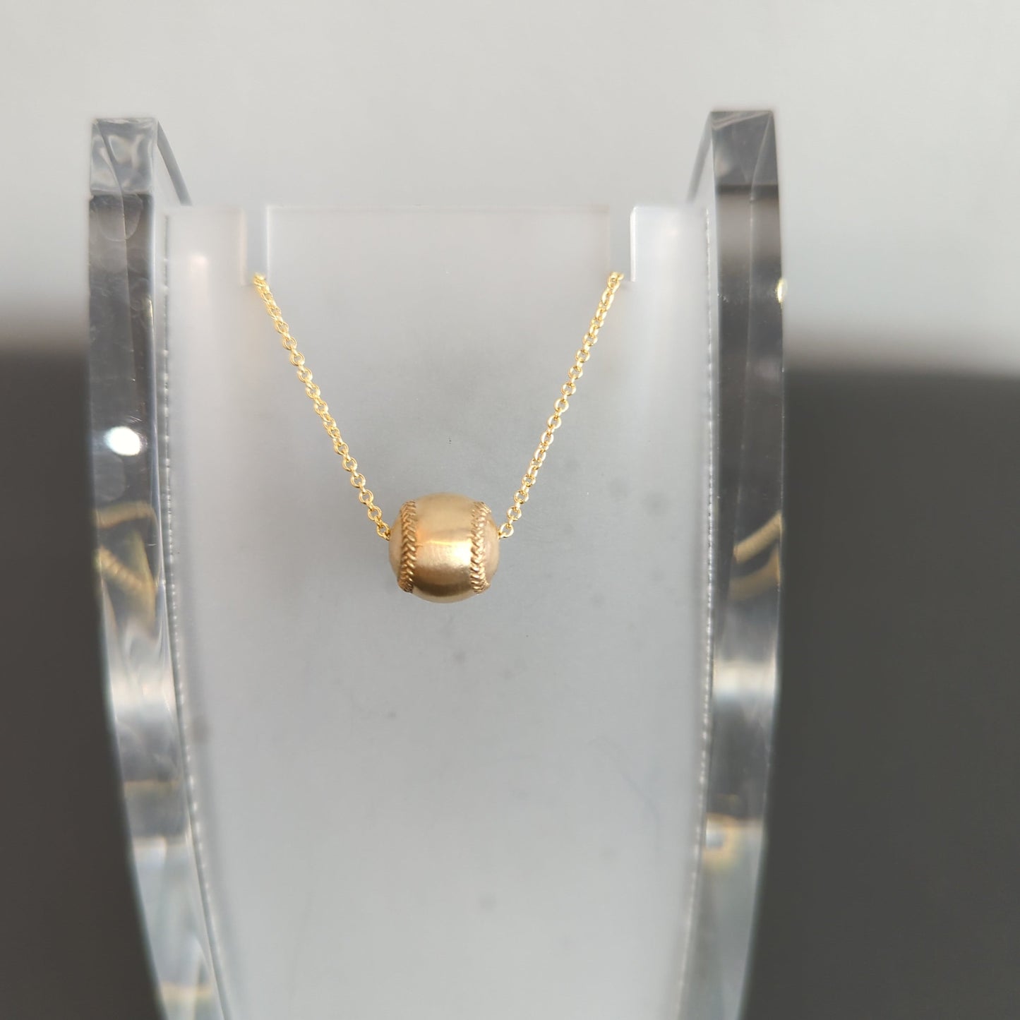 14k yellow gold softball pendant