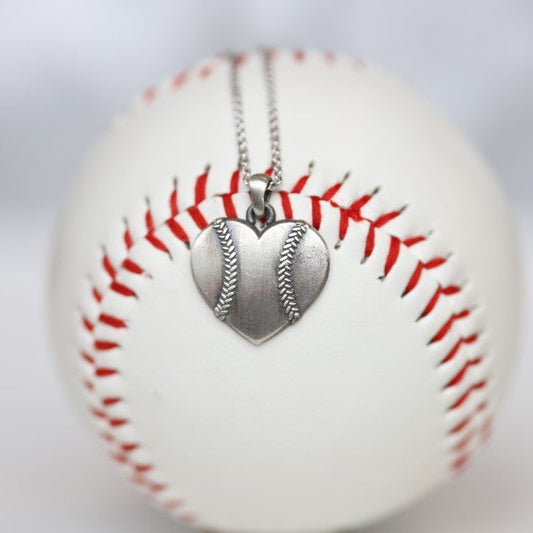 Baseball Heart Pendant in Sterling Silver Show your love of baseball with our Baseball Heart Pendant! Product Details Sterling silver Sterling silver cable chain Lobster clasp Pendant: 22mm Necklace box included