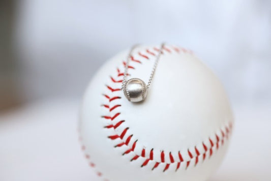 Wear this Baseball Pendant on game day and everyday! Product Details Sterling silver 18" sterling silver cable chain Lobster clasp Pendant: 9mm, baseball is 3D Necklace box included