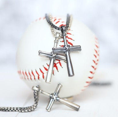 Our largest baseball cross pendant! Perfect for making a statement! Product Details Sterling silver cross pendant Sterling silver rounded box chain Lobster clasp Choose from 22" or 24" Necklace box included