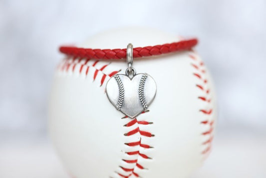 Customize your own Baseball Heart leather bracelet! Product Details Sterling silver lobster clasp Fine Italian leather Choose from sterling silver baseball or baseball heart charm Choose bracelet length (Average size for women is 7")