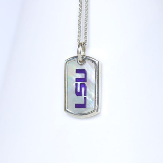 This piece is perfect for men or women! Each Mother of Pearl is one-of-a-kind. Features: Sterling silver Mother of pearl with purple enamel inlay Lobster clasp Pendant: 29x17mm