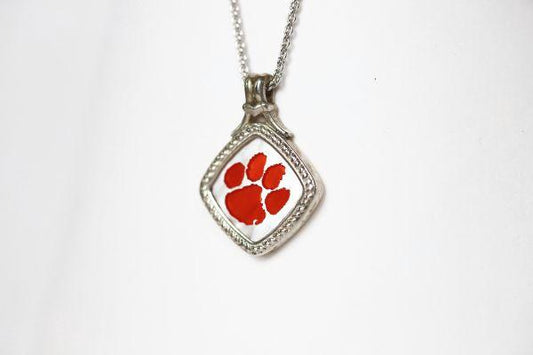 Made for the biggest Clemson fan! This is a one-of-a-kind piece. Features: Amethyst accents Man made opal center 14k gold Cable chain with lobster clasp 18" chain Officially licensed product Pendant box included