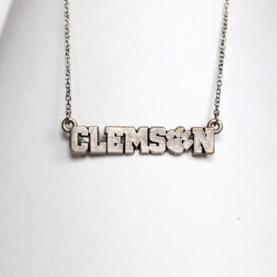 Celebrate the 2016 Clemson Tigers Football National Championship victory! Features: Sterling silver Purple and yellow enamel Lobster clasp Officially licensed product Pendant box included