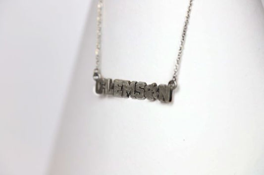 Celebrate the 2016 Clemson Tigers Football National Championship victory! Features: Sterling silver Purple and yellow enamel Lobster clasp Officially licensed product Pendant box included