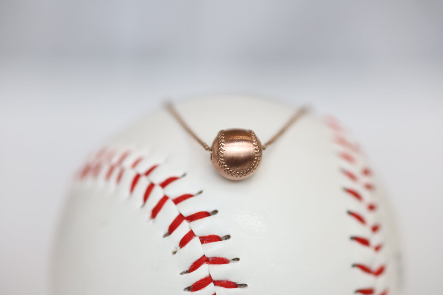 14k yellow gold softball pendant
