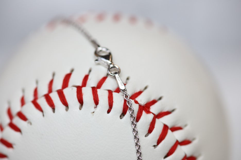This one is for the biggest fan, the one who doesn't ever miss a game and proudly sports her favorite players number win or lose. This one is for you, Mom!   Product Details  Features Mom engraving Sterling silver Sterling silver cable chain Lobster clasp Pendant: 22mm﻿ Necklace box included