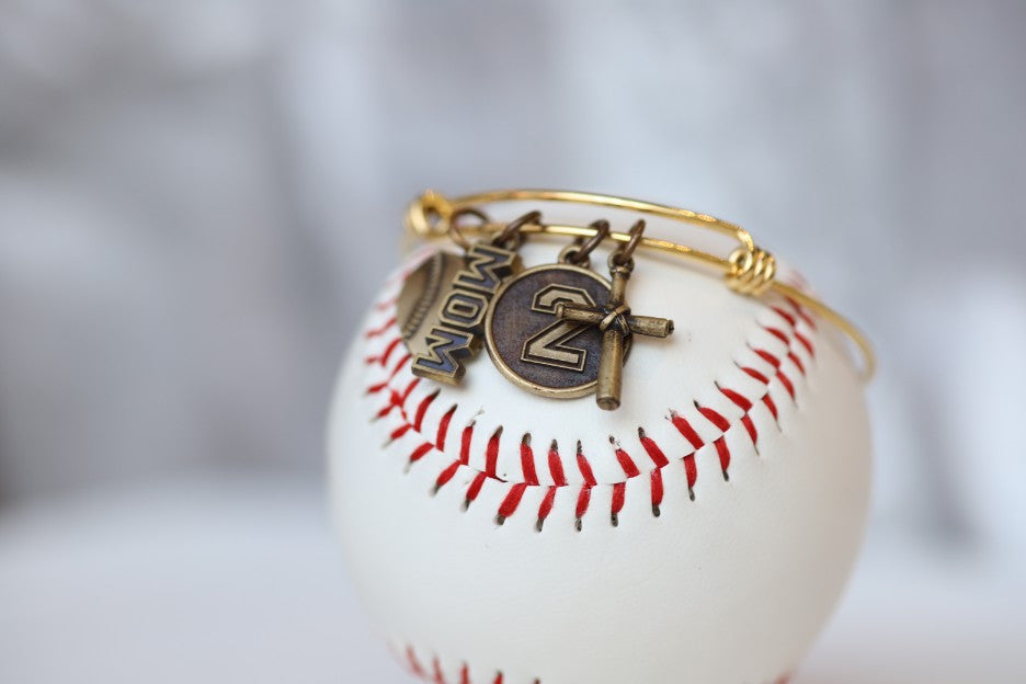 Create your own personalized charm bracelet!   This bracelet comes with the Baseball Heart Charm, please select any other charms that you would like to add to your bracelet!  If you would like to add a Jersey Number Charm: please select the number range you would like to order. There will be a place during Check Out to add this information in the "Note to Seller" box.   Product Details  Bracelet is one size fits all Color: yellow Charms: bronze