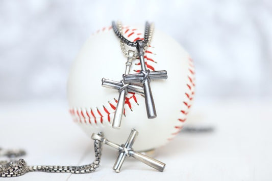 Our largest baseball cross pendant! Perfect for making a statement! Product Details  Sterling silver cross pendant Sterling silver rounded box chain Lobster clasp Choose from 22" or 24" Necklace box included