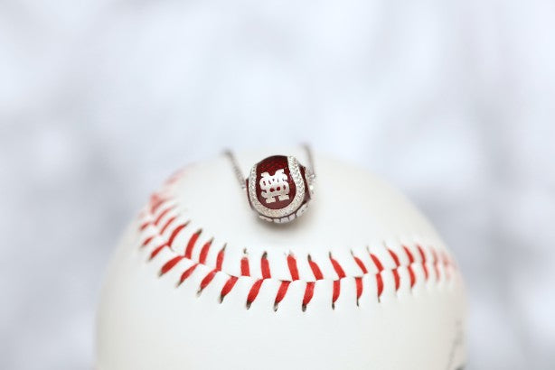 Show your support for Mississippi State Bulldogs Maroon College World Series Baseball with our officially licensed jewelry!  Product Details  Sterling silver Pendant: 12 mm Sterling silver cable chain with lobster clasp Features maroon enamel Pendant box included