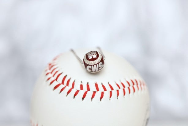 Show your support for Mississippi State Bulldogs Maroon College World Series Baseball with our officially licensed jewelry!  Product Details  Sterling silver Pendant: 12 mm Sterling silver cable chain with lobster clasp Features maroon enamel Pendant box included