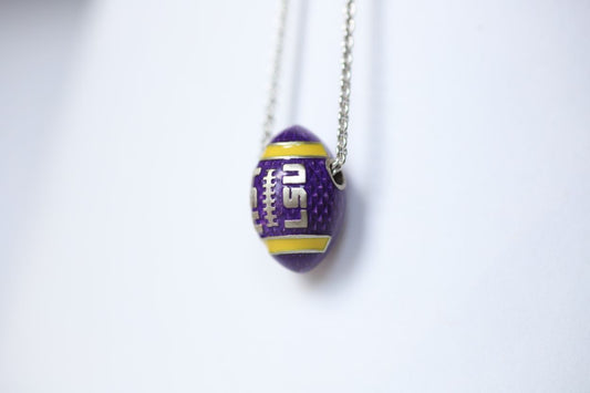 Perfect for any season! Each Mother of Pearl is one-of-a-kind.  Features:  Sterling silver Mother of pearl with purple enamel inlay Lobster clasp Pendant: 22x22mm LSU Louisiana State University Football Baseball Soccer Volleyball Track Graduate Grad Graduation Mom Dad Mother Father Wedding Gift Present Tigers Geaux Baton Rouge