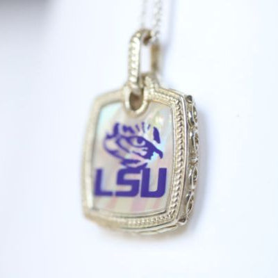 Perfect for any season! Each Mother of Pearl is one-of-a-kind.  Features:  Sterling silver Mother of pearl with purple enamel inlay Lobster clasp Pendant: 22x22mm LSU Louisiana State University Football Baseball Soccer Volleyball Track Graduate Grad Graduation Mom Dad Mother Father Wedding Gift Present Tigers Geaux Baton Rouge