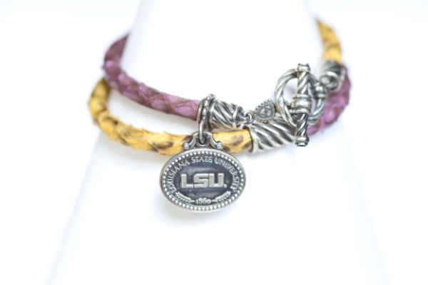 Finish off your LSU game day look with our purple and gold leather charm bracelet.   Features:  Sterling silver Toggle clasp Stingray leather  Double sided charm Officially licensed product football baseball soccer volleyball cheer mom dad father wedding gift present men women Louisiana State university purple gold yellow tigers leather lsu lsu lsu  
